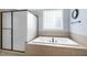 Spa-like main bathroom with a walk-in shower and soaking tub at 306 Village Orchard Rd, Cary, NC 27519