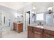 Elegant main bathroom with dual vanities and large mirrors at 306 Village Orchard Rd, Cary, NC 27519