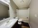 A bright bathroom with a tub and shower combination and a vanity with a large mirror at 3211 Kipling Rd, Fuquay Varina, NC 27526