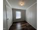 This bedroom has light walls, hardwood floors and a window for natural light at 3211 Kipling Rd, Fuquay Varina, NC 27526