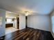 Open-concept living room flowing into the kitchen with modern flooring at 3211 Kipling Rd, Fuquay Varina, NC 27526