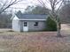 Exterior view of detached block building with a single window and entry door at 3211 Kipling Rd, Fuquay Varina, NC 27526