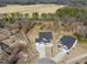 Aerial view of a home with a spacious lot and privacy fence, close to green space and other residences at 33 Song Breeze Cir, Angier, NC 27501