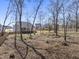 Home exterior overlooking a spacious backyard with a wooden deck perfect for outdoor activities and relaxation at 33 Song Breeze Cir, Angier, NC 27501