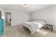 Large bedroom with neutral carpet, a plaid comforter, and natural light at 33 Song Breeze Cir, Angier, NC 27501