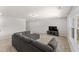Bonus room featuring plush carpeting, recessed lighting, and large couch at 33 Song Breeze Cir, Angier, NC 27501