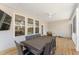 Comfortable covered deck with full dining set, mounted tv, and ceiling fan at 33 Song Breeze Cir, Angier, NC 27501