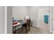 Bright craft room with work table, sewing machine, and storage near a bedroom at 33 Song Breeze Cir, Angier, NC 27501
