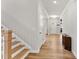 Inviting home entryway with wood-look floors and staircase at 33 Song Breeze Cir, Angier, NC 27501