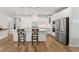 Bright and modern kitchen with a large island, stainless steel appliances, and pendant lighting at 33 Song Breeze Cir, Angier, NC 27501