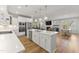 Spacious kitchen featuring an island, stainless steel appliances, and an open layout to the living area at 33 Song Breeze Cir, Angier, NC 27501