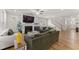 Bright, open living room features a fireplace, ceiling fan, and modern furnishings at 33 Song Breeze Cir, Angier, NC 27501