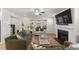 Cozy living room with a fireplace, lots of natural light, and comfortable seating at 33 Song Breeze Cir, Angier, NC 27501