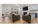 Large living room with wood floors and lots of natural light offers access to outdoor patio at 33 Song Breeze Cir, Angier, NC 27501