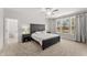 Spacious main bedroom with large windows, neutral tones and ensuite bath visible at 33 Song Breeze Cir, Angier, NC 27501
