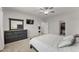 Bright main bedroom with large dresser, ceiling fan, and walk-in closet at 33 Song Breeze Cir, Angier, NC 27501