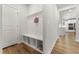 Bright mudroom features a built-in bench with storage cubbies and convenient coat hooks at 33 Song Breeze Cir, Angier, NC 27501