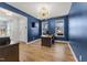 Stylish home office with blue walls, ample lighting, and a view of the outdoors at 33 Song Breeze Cir, Angier, NC 27501