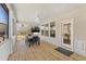 Covered porch with a dining area and outdoor TV at 33 Song Breeze Cir, Angier, NC 27501