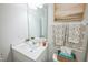 Bright bathroom with a white vanity, decorative towels, and modern fixtures creating a serene atmosphere at 3730 Mason Bluff Dr, Raleigh, NC 27616