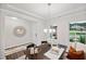 Elegant dining room with a decorative mirror and modern chandelier at 3730 Mason Bluff Dr, Raleigh, NC 27616