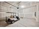 Spacious garage with a golf cart, ample room for storage, and a ceiling-mounted garage door opener at 3730 Mason Bluff Dr, Raleigh, NC 27616