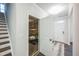 Entryway revealing the garage with a golf cart and access to the front door and stairs at 3730 Mason Bluff Dr, Raleigh, NC 27616