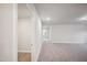 Bright neutral hallway with tile flooring and a view to a bedroom at 3730 Mason Bluff Dr, Raleigh, NC 27616