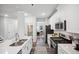 Modern kitchen featuring stainless steel appliances and white cabinetry at 3730 Mason Bluff Dr, Raleigh, NC 27616