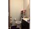 Bathroom featuring a vanity, toilet and a wire rack with essentials at 402 Todd Hill Dr, Wendell, NC 27591