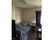 Modest bedroom with fair lighting and a standard size bed with grey quilt at 402 Todd Hill Dr, Wendell, NC 27591