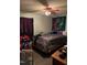 Bedroom featuring a queen bed, tapestry and assorted furniture at 402 Todd Hill Dr, Wendell, NC 27591