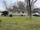Charming single-story home with green siding, maroon shutters, and a well-maintained lawn at 402 Todd Hill Dr, Wendell, NC 27591