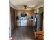 A kitchen features wooden cabinets, laminate floors, granite countertops, and stainless steel appliances at 402 Todd Hill Dr, Wendell, NC 27591