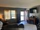 Comfortable living room featuring hardwood floors, a cozy couch, and a warm fireplace at 402 Todd Hill Dr, Wendell, NC 27591