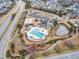 Aerial view of community clubhouse, pool, and other outdoor amenities at 413 Westfalen Dr, Cary, NC 27519