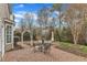 Backyard featuring a beautiful brick patio with outdoor dining set at 413 Westfalen Dr, Cary, NC 27519