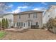 View of the home's exterior and backyard with patio at 413 Westfalen Dr, Cary, NC 27519