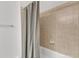 Bathroom with beige tile walls and neutral colored shower curtain at 413 Westfalen Dr, Cary, NC 27519