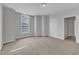 Bright carpeted bedroom with neutral walls and trim at 413 Westfalen Dr, Cary, NC 27519