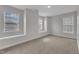 Spacious carpeted bedroom with many windows and natural light at 413 Westfalen Dr, Cary, NC 27519