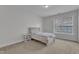 Neutral bedroom with plush carpet, natural light, and minimalist decor at 413 Westfalen Dr, Cary, NC 27519