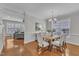 Bright dining room with hardwood floors and a large window for natural light at 413 Westfalen Dr, Cary, NC 27519