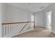 Bright hallway features neutral carpet and painted trim with access to additional rooms at 413 Westfalen Dr, Cary, NC 27519