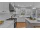 Well-appointed kitchen featuring white subway tile backsplash and stainless steel appliances at 413 Westfalen Dr, Cary, NC 27519