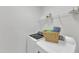 Functional laundry room featuring a washer, dryer, shelving, and storage space at 413 Westfalen Dr, Cary, NC 27519