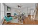Bright living room features a fireplace, hardwood floors, and staircase at 413 Westfalen Dr, Cary, NC 27519