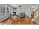 Comfortable living room features a fireplace, hardwood floors, and plenty of seating at 413 Westfalen Dr, Cary, NC 27519