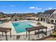 Community pool area with pergola covered seating, clubhouse and ample lounge space for residents to enjoy in a gated community at 413 Westfalen Dr, Cary, NC 27519