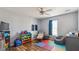 Playful bedroom with colorful accents, wood floors, and a ceiling fan at 424 Crystal Spring Dr, Sanford, NC 27332